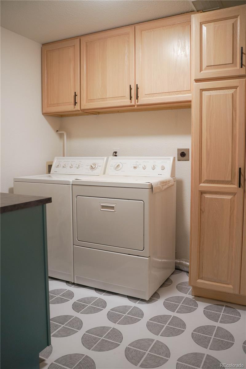 1709 Red Hawk Road Silverthorne, CO 80498 - Photo 43 of 50 a kitchen with a sink and a refrigerator
