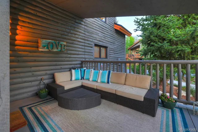 a view of a deck with a table and chairs and wooden floor