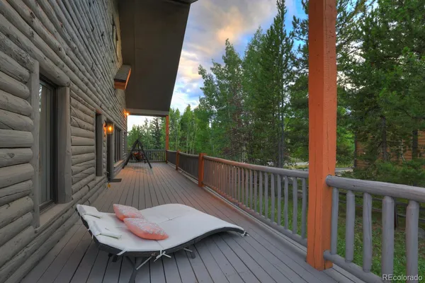 a view of balcony with wooden floor and outdoor seating
