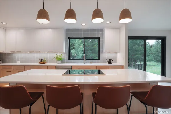 a view of a dining room with furniture window and outside view