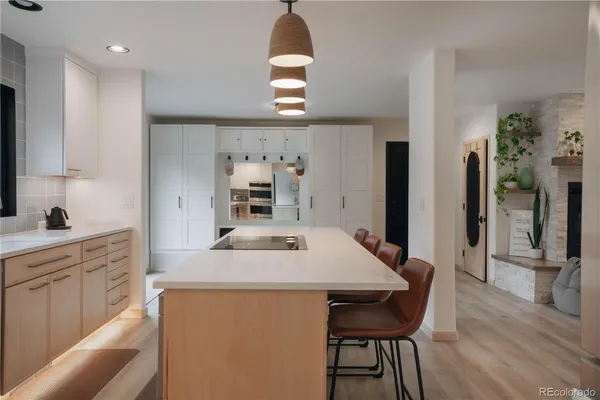 a kitchen with a table and chairs in it