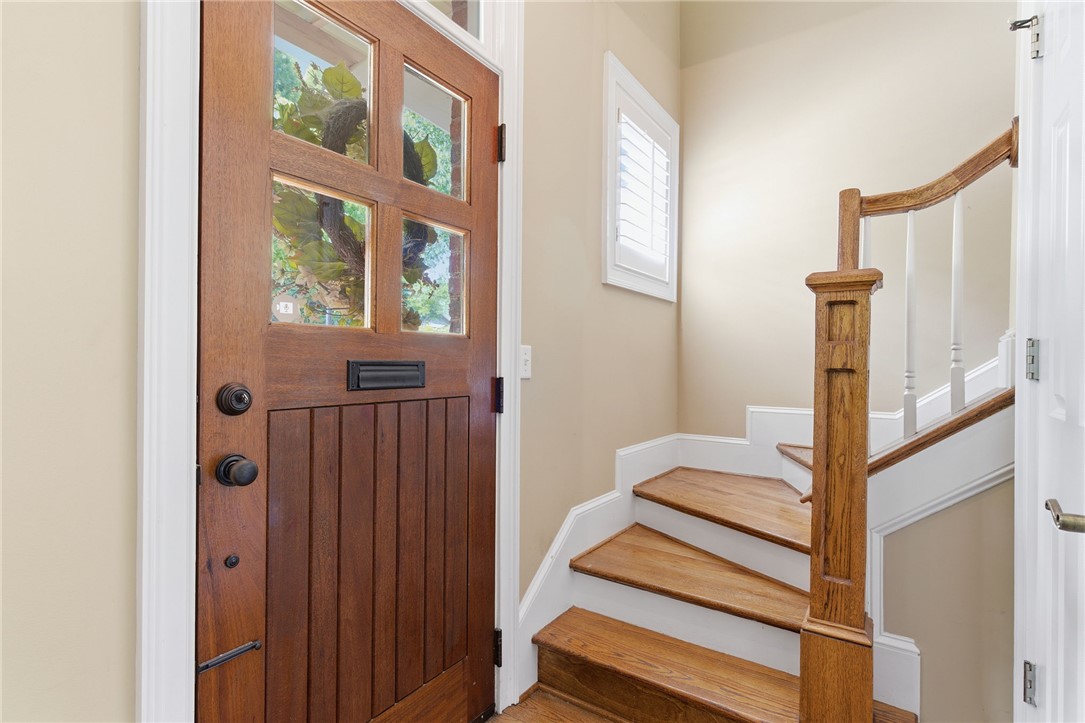 204 Butler Avenue Greenville, SC 29601 - Photo 4 of 26 A rich wood entry door welcomes you into this inviting foyer with gleaming hardwood stairs.