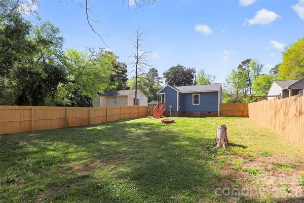 a house view with a backyard space
