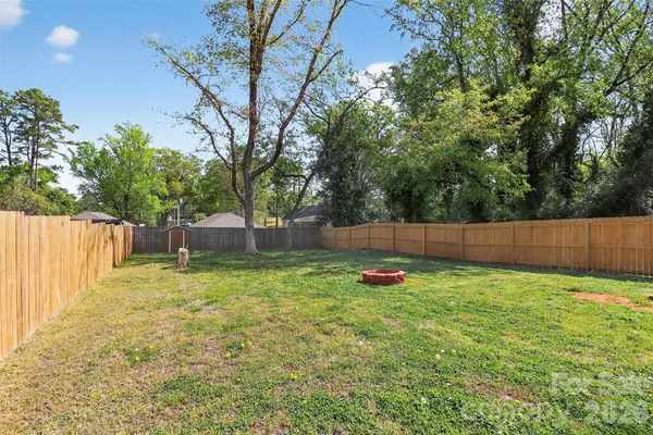 a view of a backyard with a small cabin