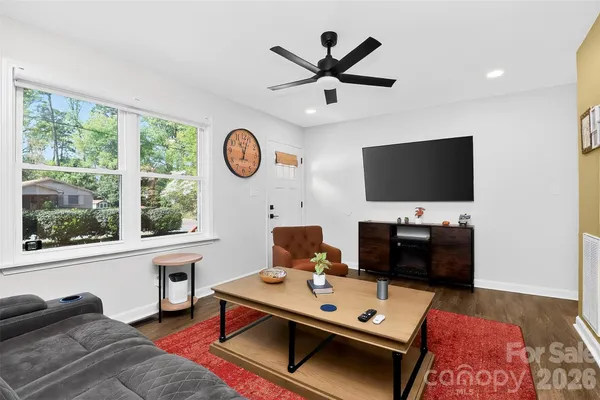 a room with furniture and a flat screen tv