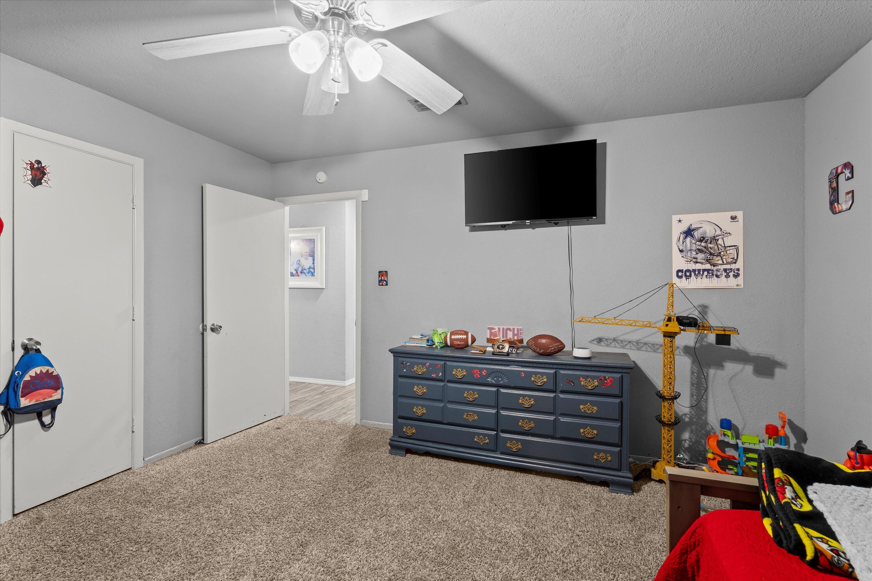 3718 South State Road, Unit 303 Sundown, TX 79372 - Photo 16 of 23 a living room with furniture and a flat screen tv