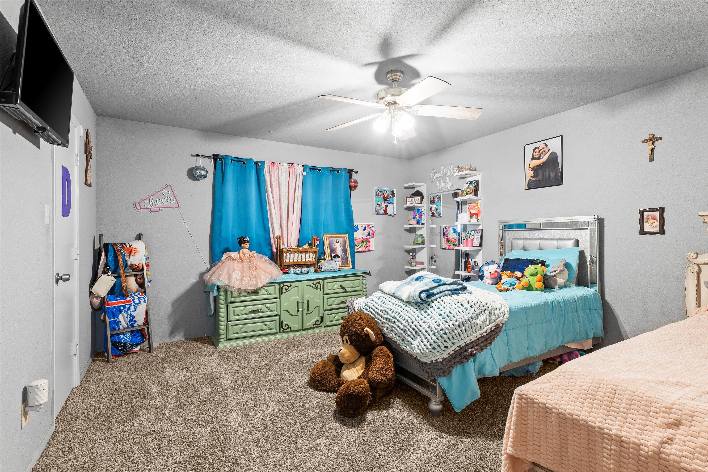 3718 South State Road, Unit 303 Sundown, TX 79372 - Photo 17 of 23 a living room with furniture and a flat screen tv