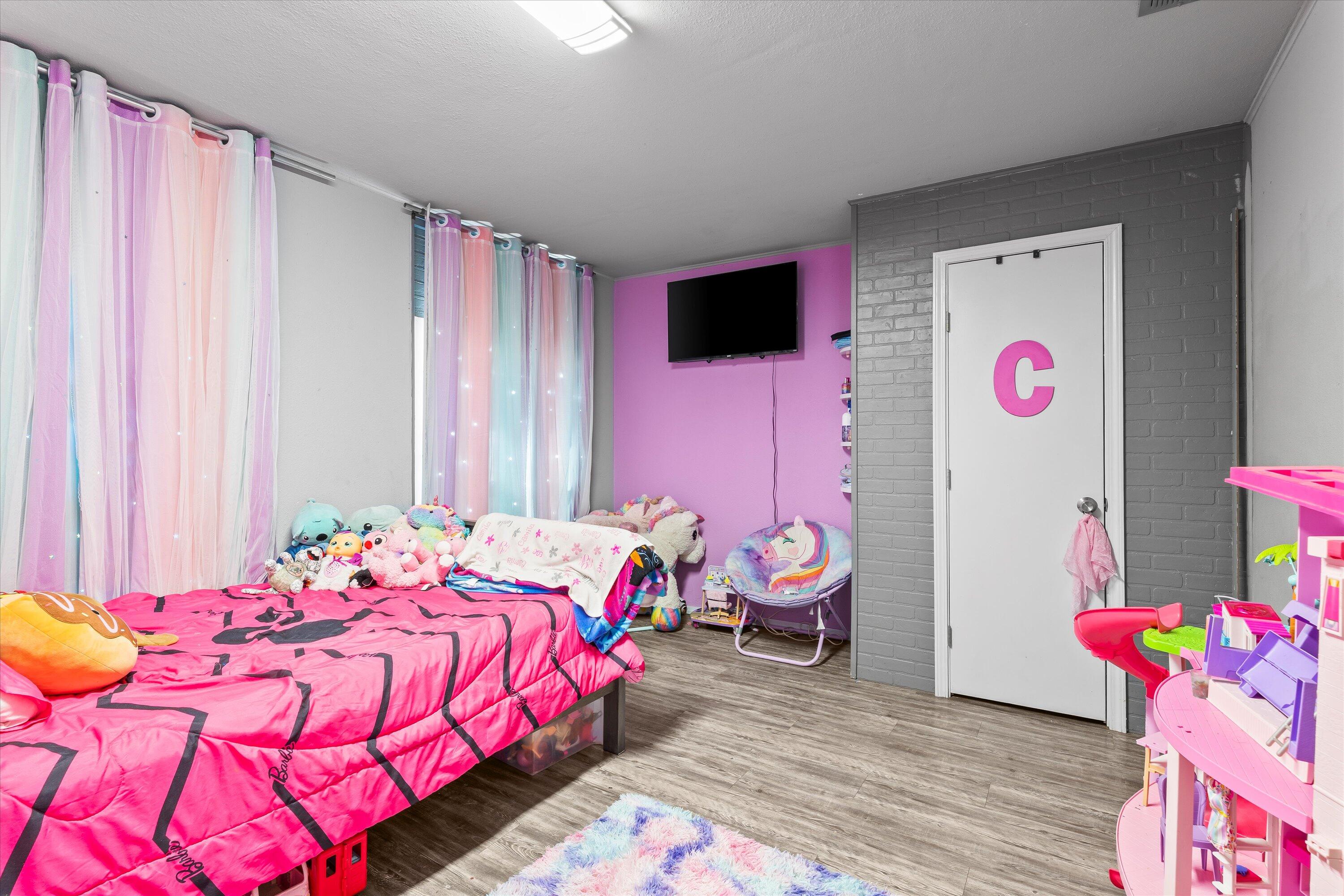 3718 South State Road, Unit 303 Sundown, TX 79372 - Photo 19 of 23 a bedroom with a bed and a window