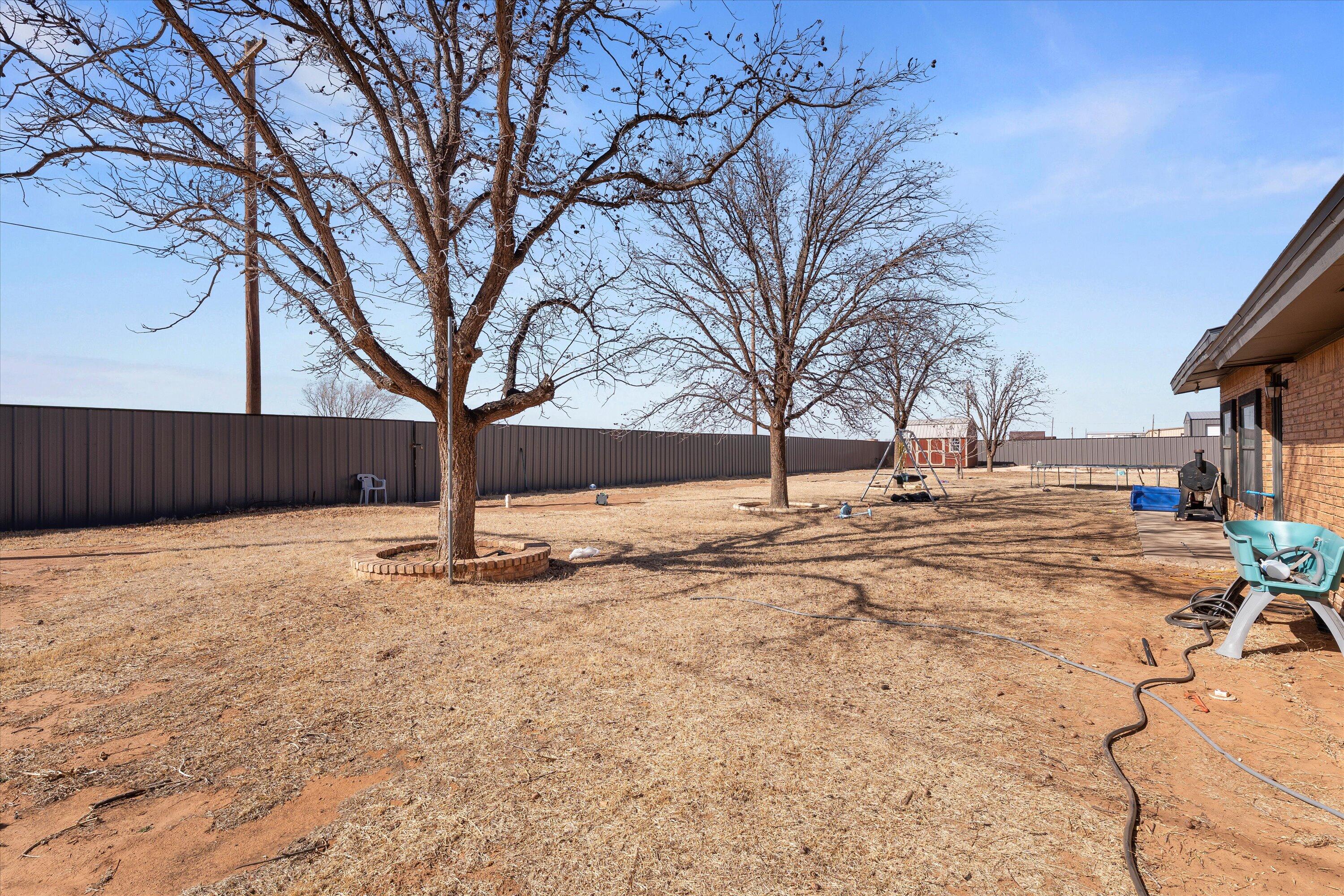 3718 South State Road, Unit 303 Sundown, TX 79372 - Photo 20 of 23 a view of yard covered with snow in front of house
