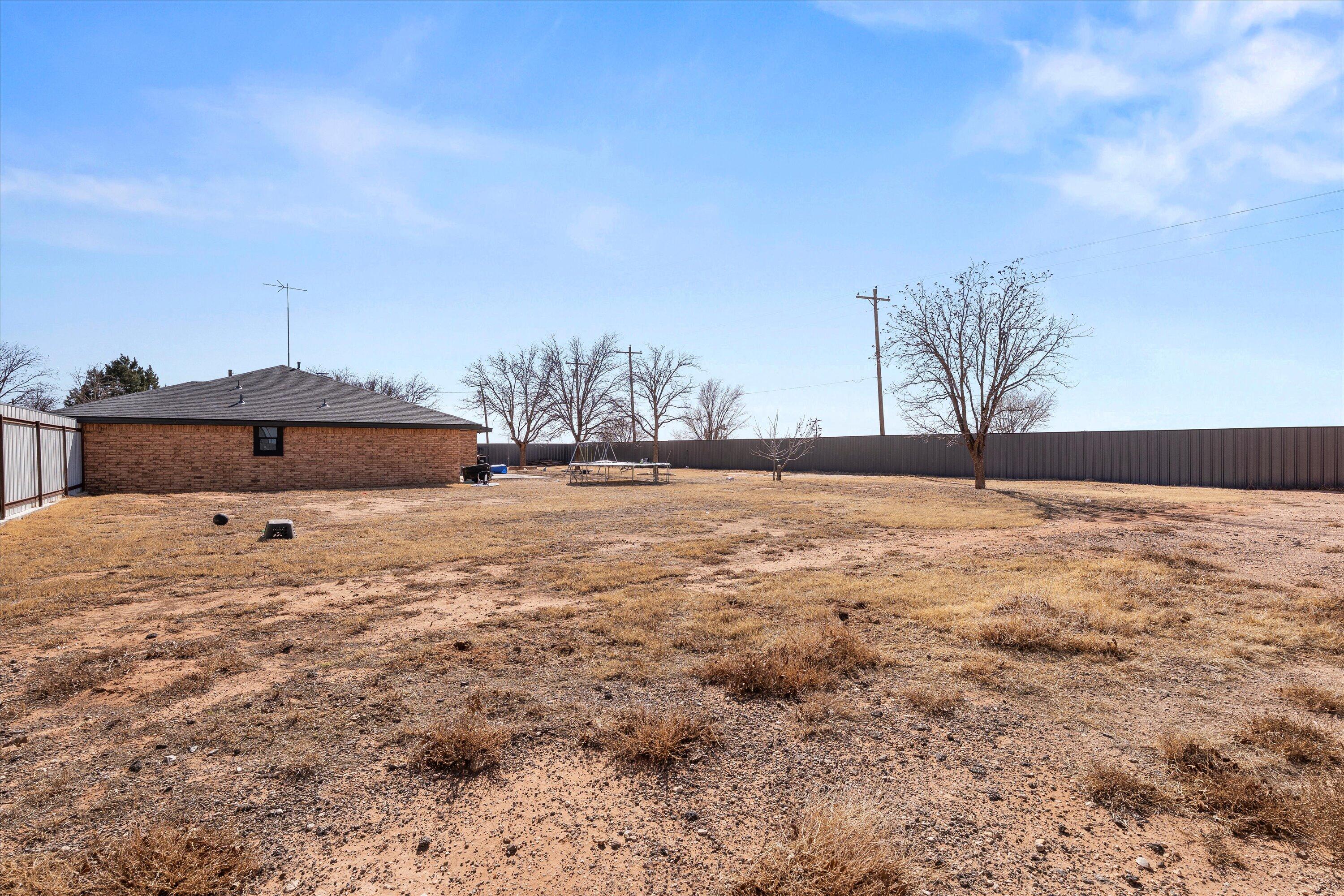 3718 South State Road, Unit 303 Sundown, TX 79372 - Photo 22 of 23 a view of house with a yard
