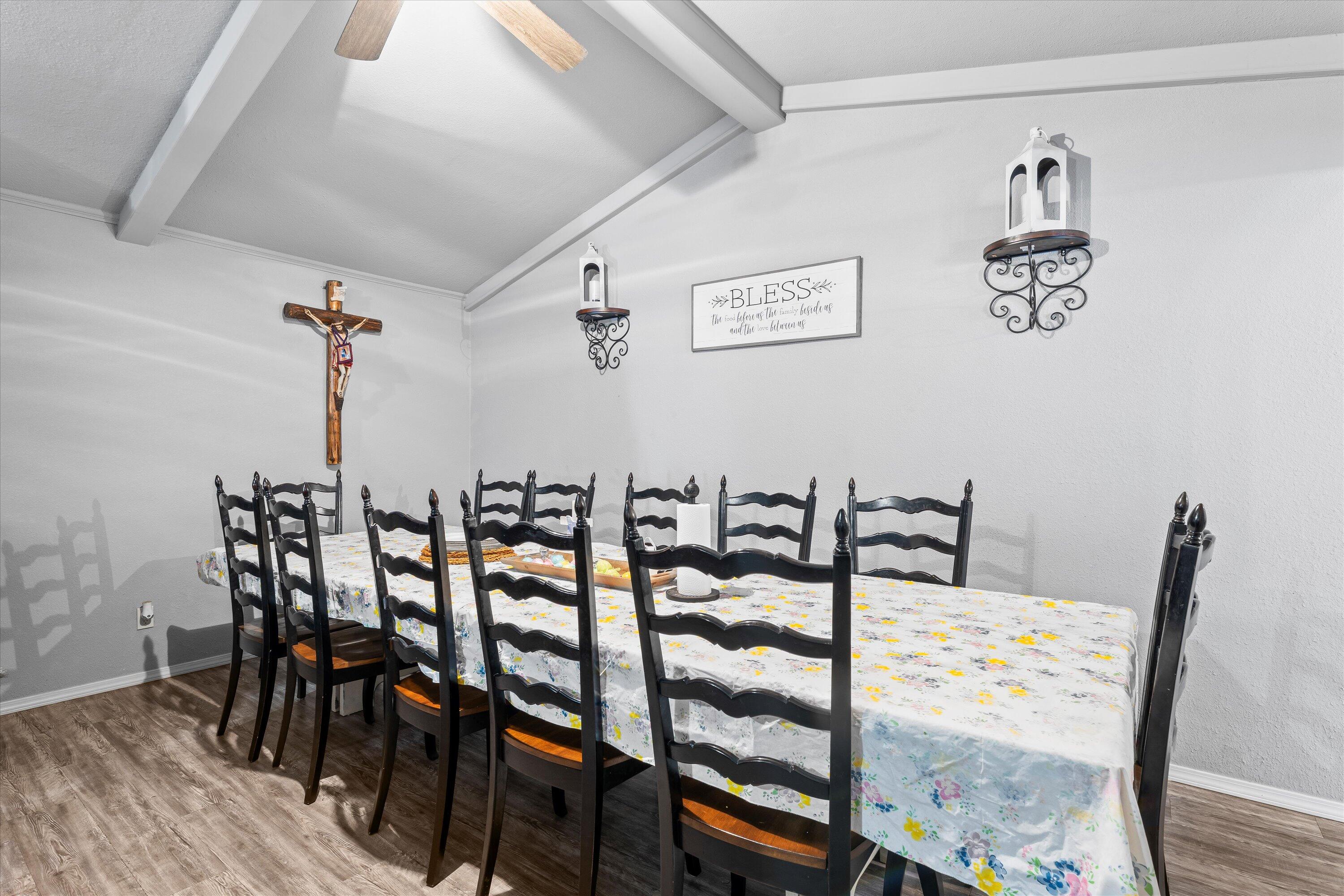 3718 South State Road, Unit 303 Sundown, TX 79372 - Photo 7 of 23 a view of a dining room with furniture and wooden floor