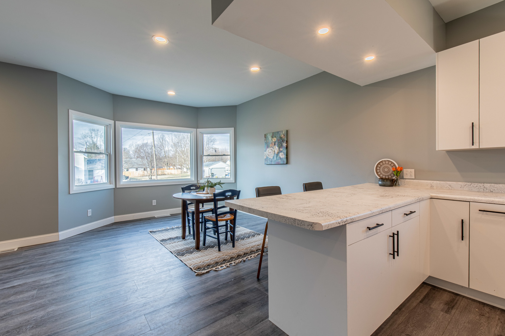 204 East South Street Sheffield, IL 61361 - Photo 8 of 30 a open kitchen with stainless steel appliances granite countertop a stove and a wooden floors