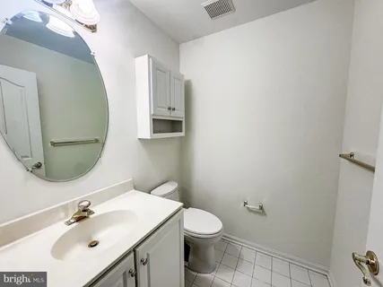 a view of empty room with window and fireplace