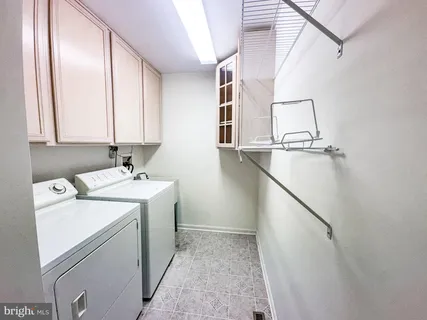 a bathroom with a sink mirror and toilet