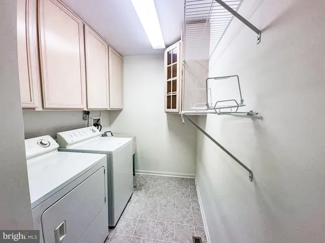 a bathroom with a sink mirror and toilet