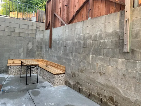 a bath room with a table and a chair