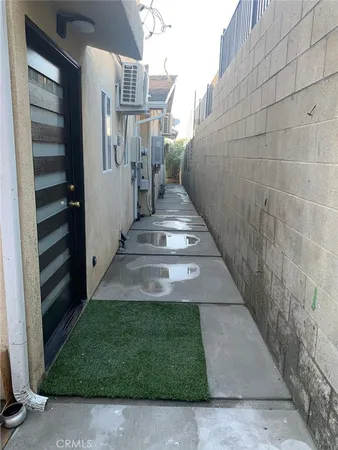 a view of a pathway of a house with backyard