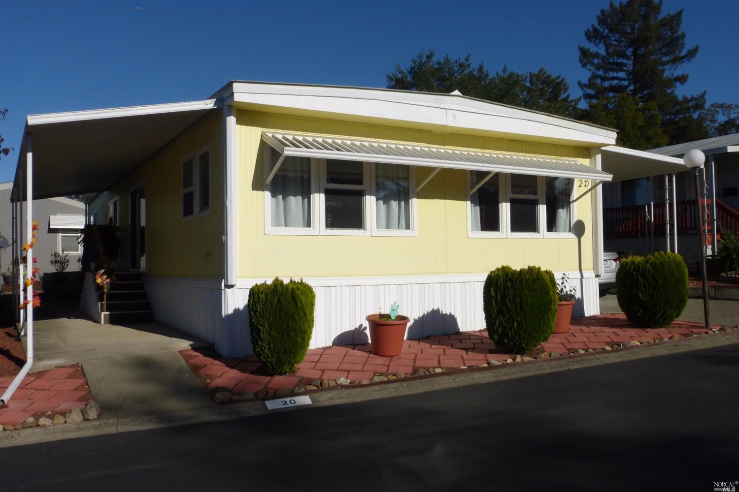20 Cardinal Way, Unit 20 Santa Rosa, CA 95409 - Photo 1 of 1 a front view of a house with yard