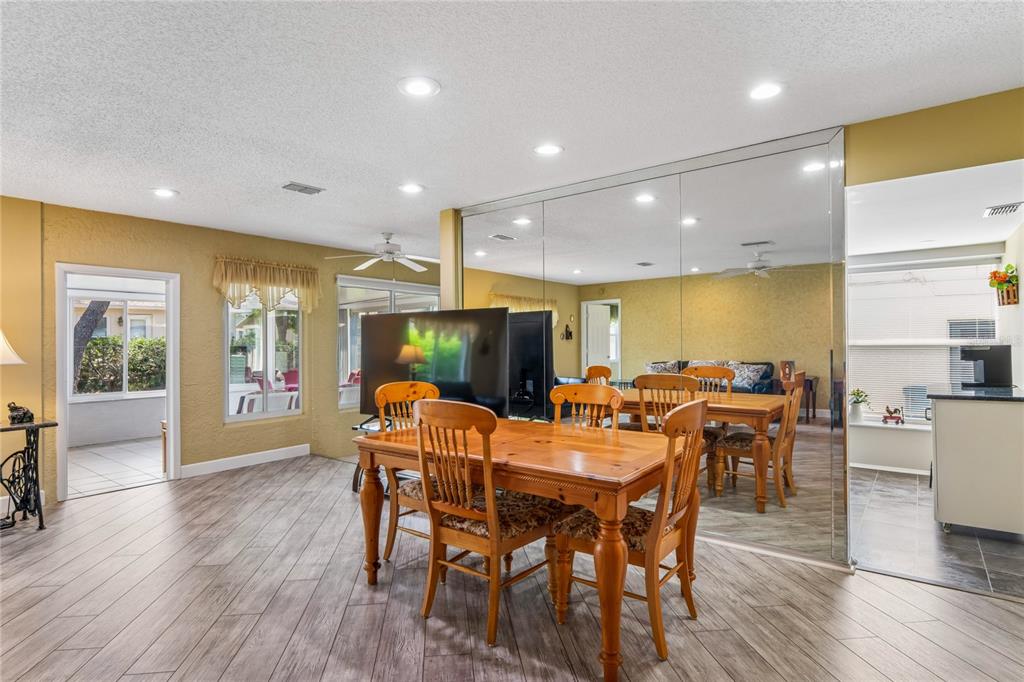 2252 Pebble Beach Drive Spring Hill, FL 34606 - Photo 18 of 100 a view of a dining room with furniture window and wooden floor
