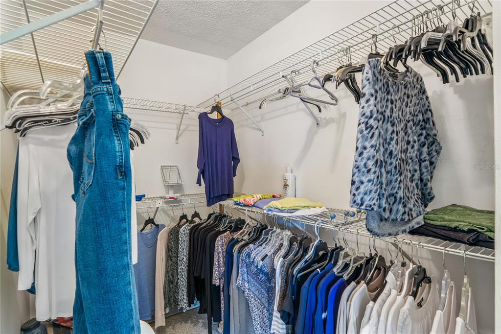 2252 Pebble Beach Drive Spring Hill, FL 34606 - Photo 24 of 100 a view of walk in closet with clothes and shoes