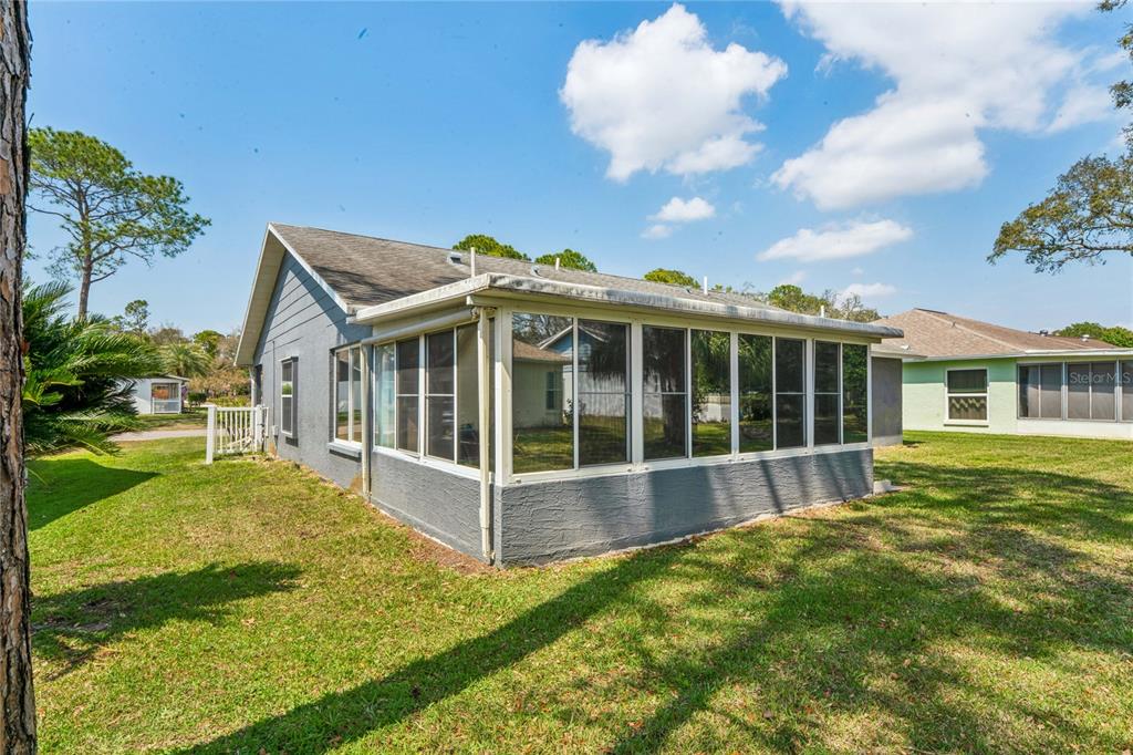 2252 Pebble Beach Drive Spring Hill, FL 34606 - Photo 35 of 100 a view of a house with yard and sitting area