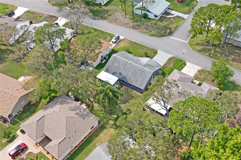 2252 Pebble Beach Drive Spring Hill, FL 34606 - Photo 44 of 100 an aerial view of a house with a yard and tennis court