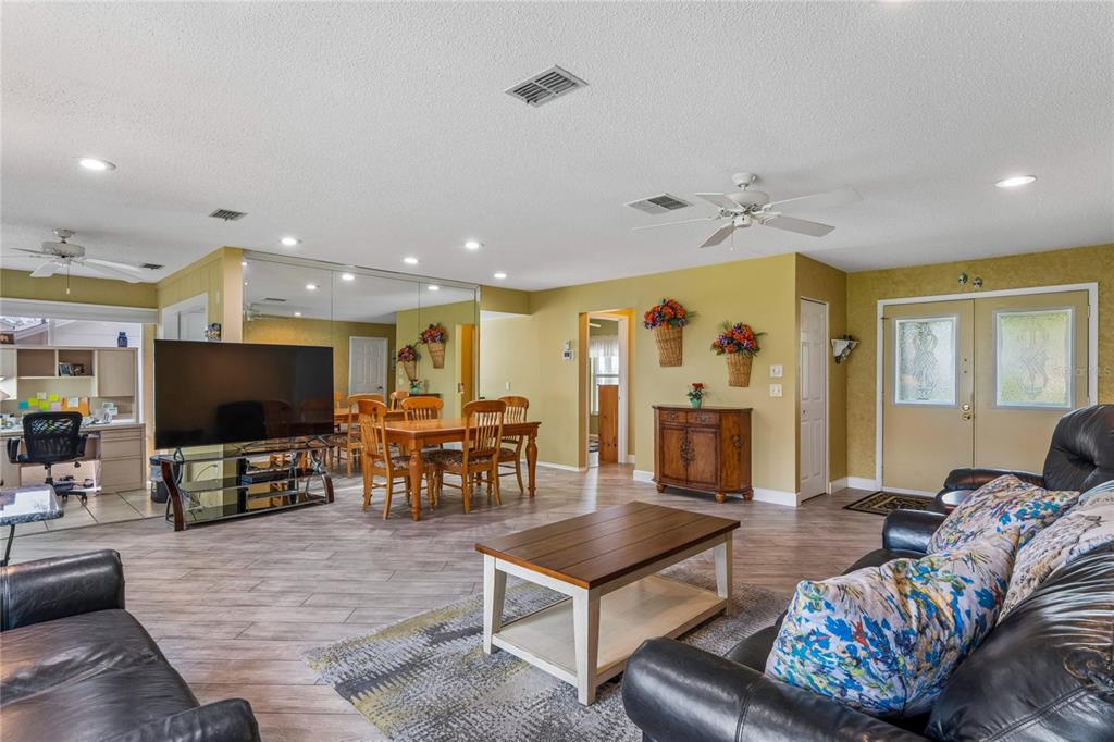 2252 Pebble Beach Drive Spring Hill, FL 34606 - Photo 10 of 100 a living room with furniture and a flat screen tv
