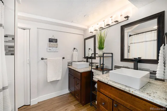 a view of living room with granite countertop cabinets and sink