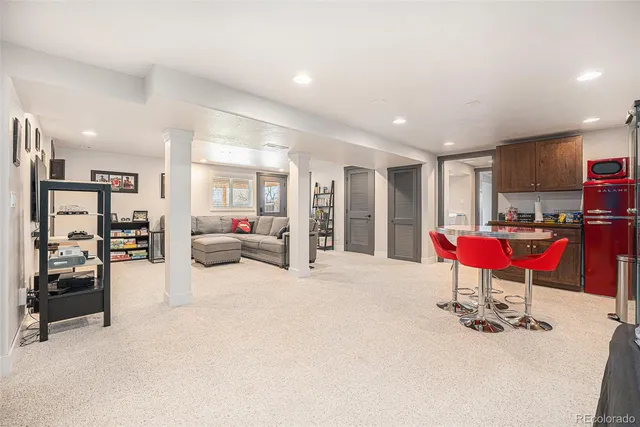 a room with furniture and air hockey table
