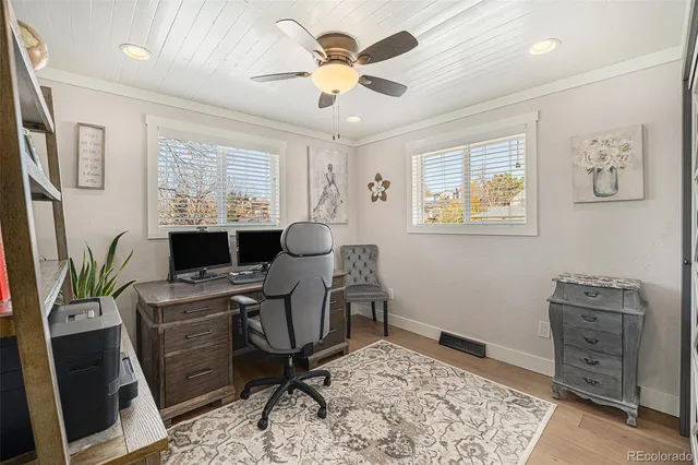 a work room with furniture and window
