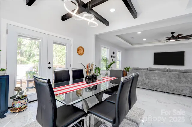a view of a dining room with furniture and window