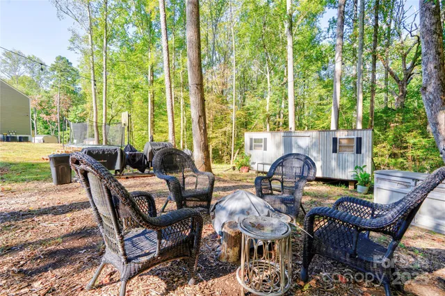 a view of an outdoor space with furniture and garden