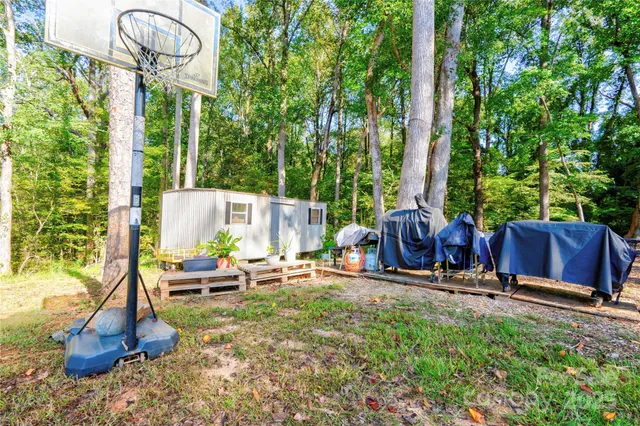 a view of a chairs and table in the garden