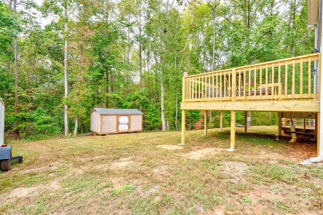 a view of a house with backyard porch and sitting area