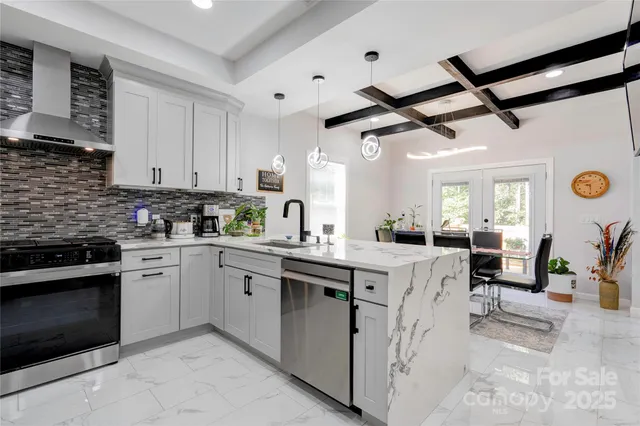 a kitchen with cabinets a sink and appliances