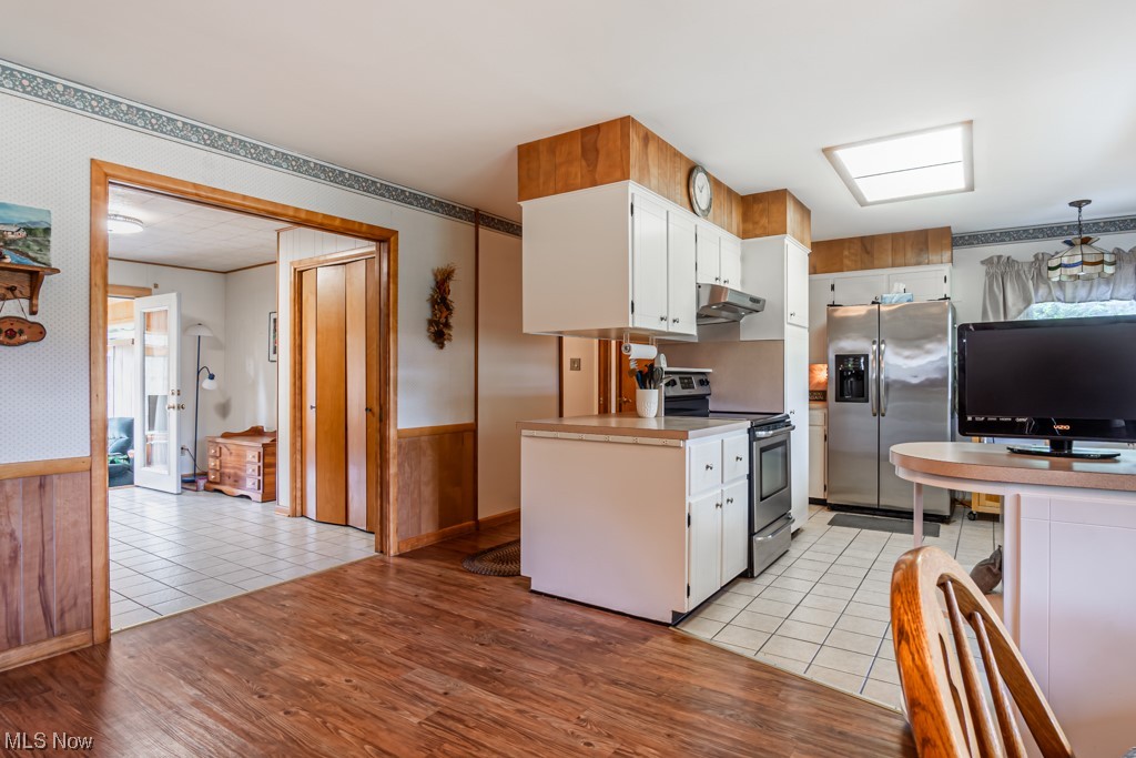 31207 Tower Road Salem, OH 44460 - Photo 15 of 34 Kitchen featuring stainless steel appliances, light tile flooring, white cabinets,