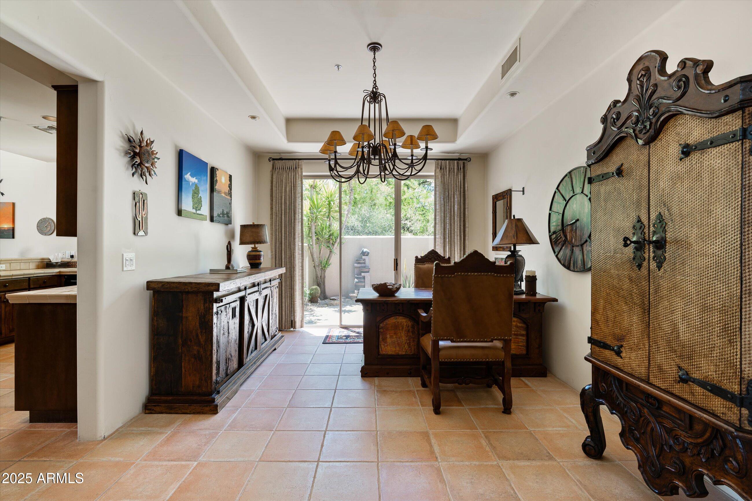 34221 North Boulders Parkway Scottsdale, AZ 85266 - Photo 15 of 31 a living room with furniture a window and a chandelier
