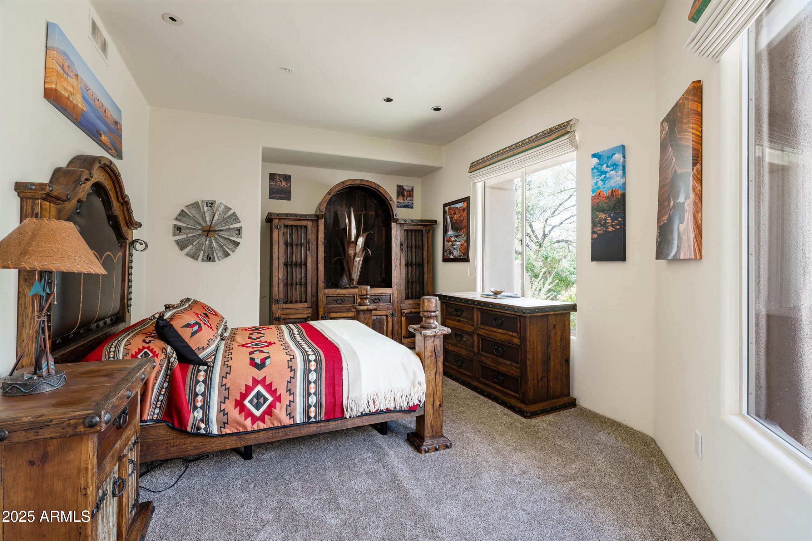 34221 North Boulders Parkway Scottsdale, AZ 85266 - Photo 22 of 31 a bedroom with bed and window