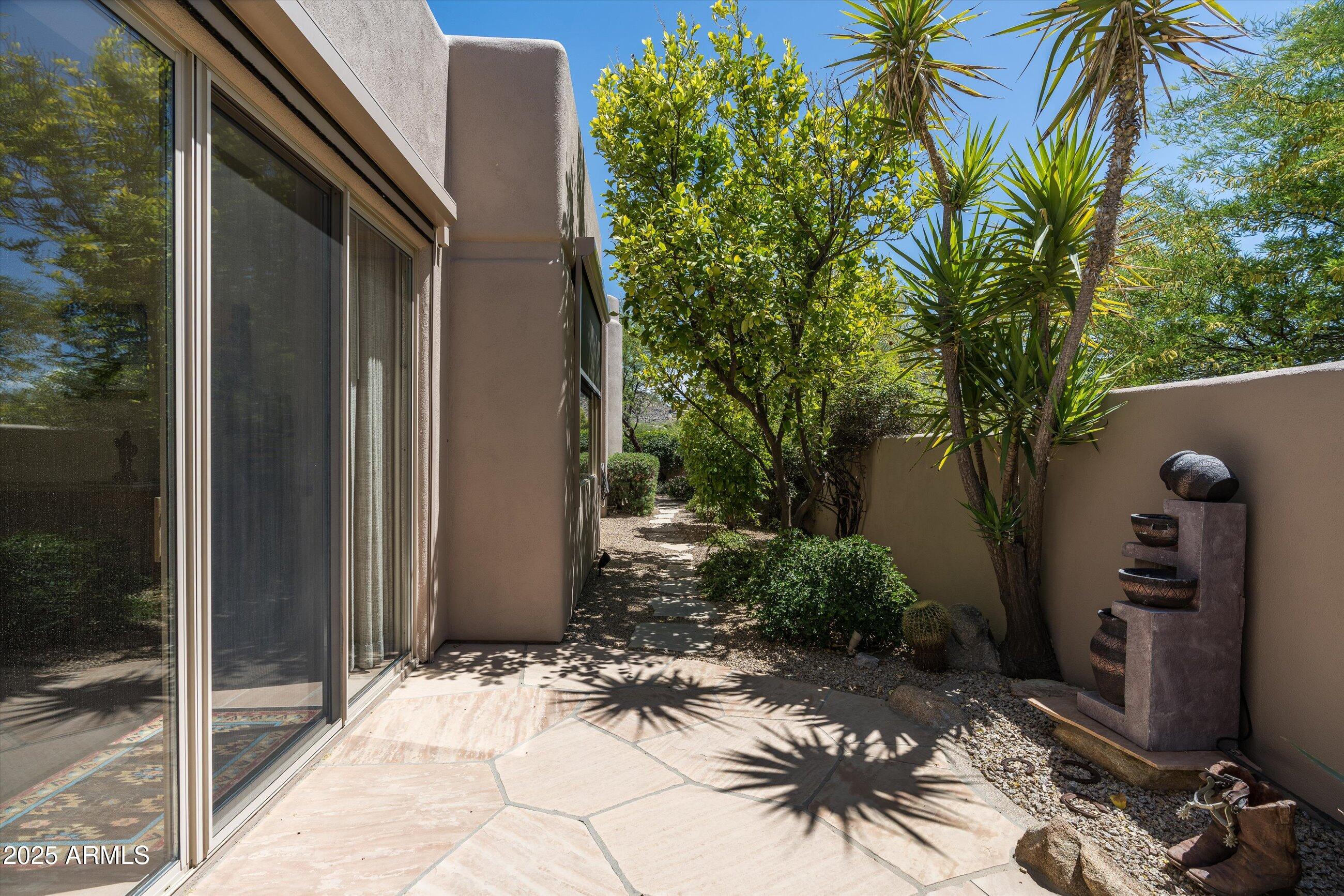 34221 North Boulders Parkway Scottsdale, AZ 85266 - Photo 28 of 31 a view of backyard path and trees