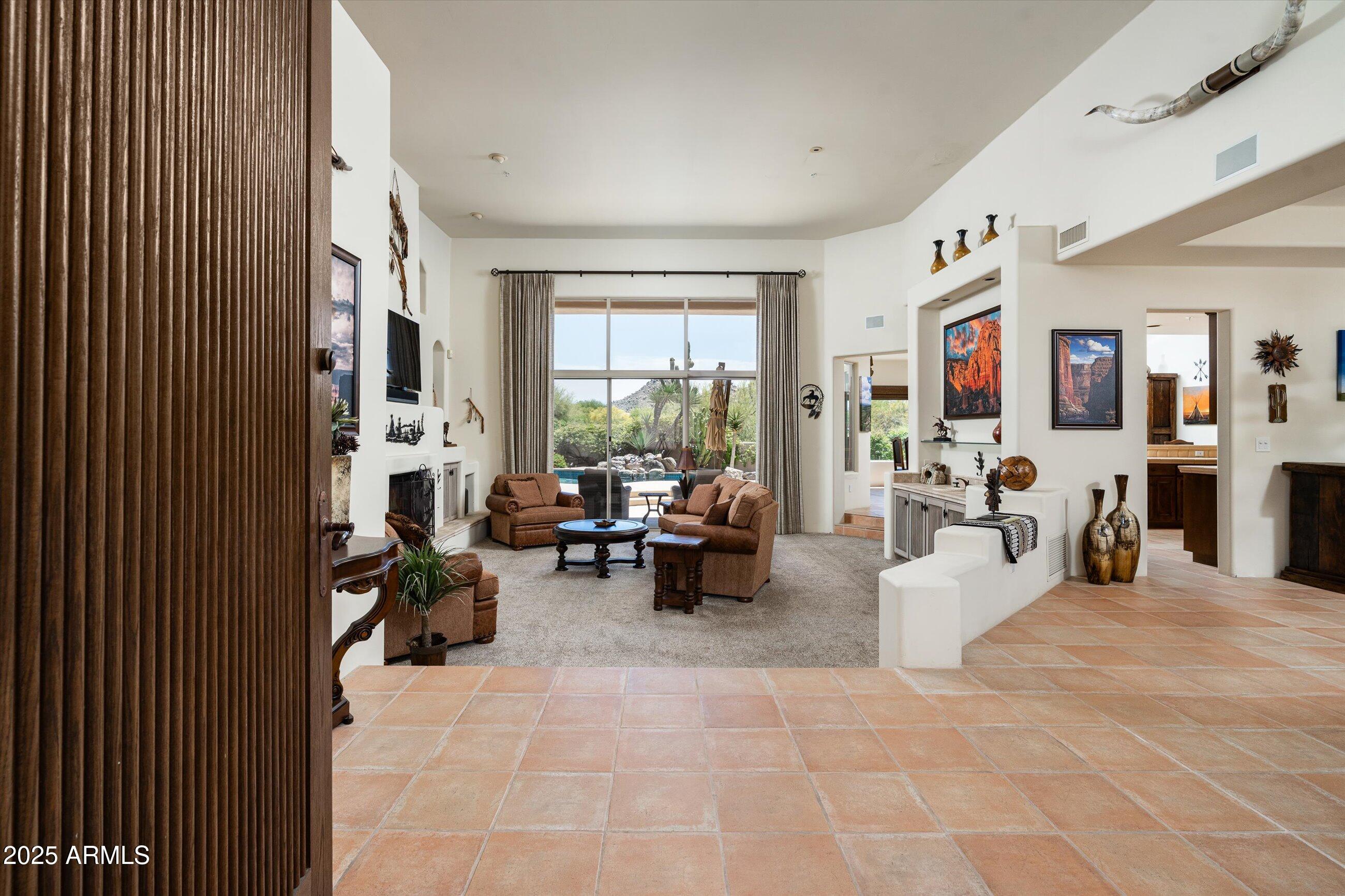 34221 North Boulders Parkway Scottsdale, AZ 85266 - Photo 5 of 31 a living room with furniture and large windows