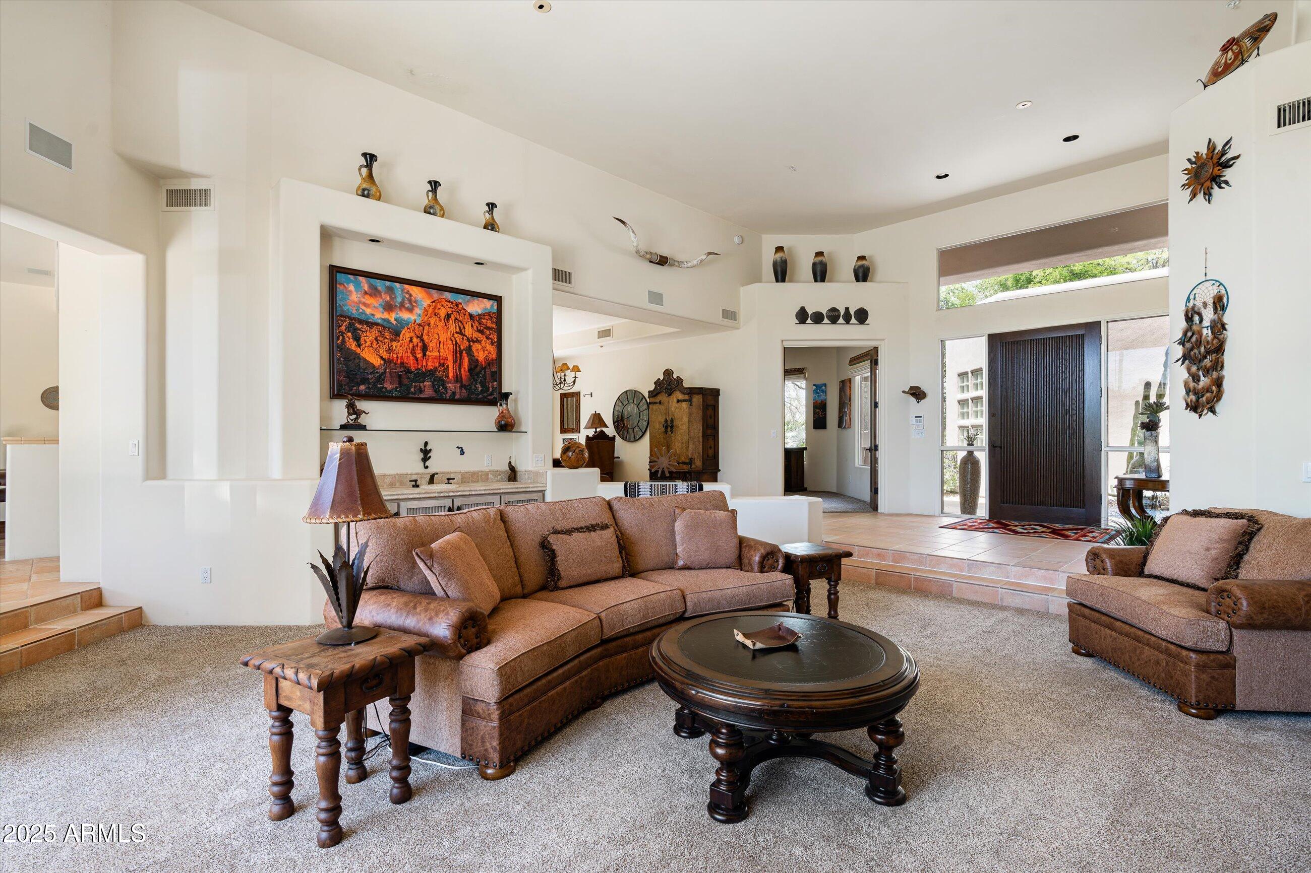 34221 North Boulders Parkway Scottsdale, AZ 85266 - Photo 7 of 31 a living room with furniture and a flat screen tv