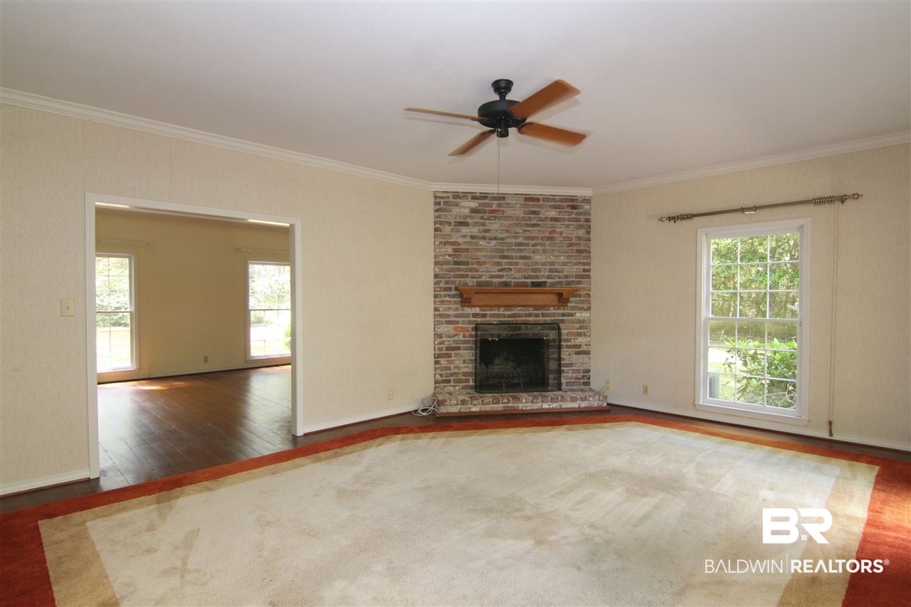 7147 Chapman Street Fairhope, AL 36532 - Photo 11 of 48 Rug can be removed. This room has hardwood flrs
