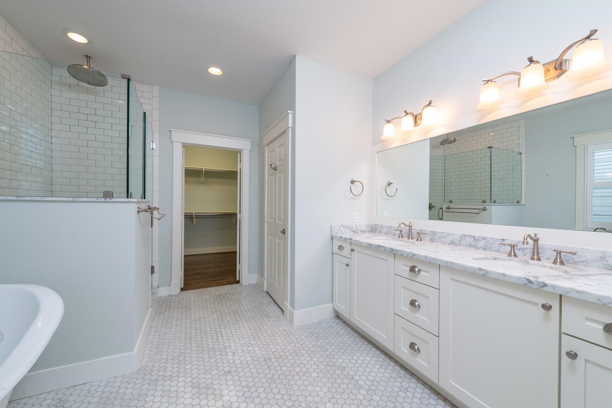 734 Allston Street, Unit B Houston, TX 77007 - Photo 14 of 28 The primary retreat has a magazine style where time in this oasis is cherished.