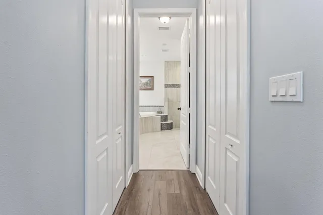 a view of a bathroom from the hallway