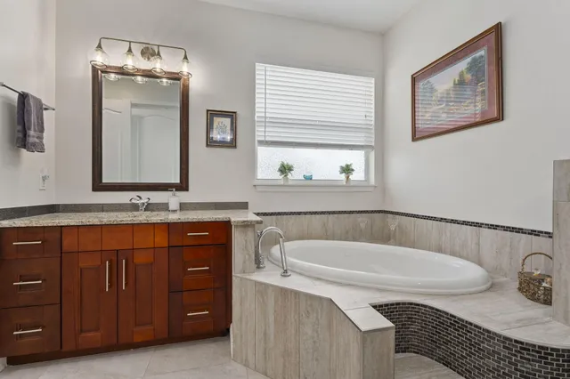 a view of walk in closet with clothes