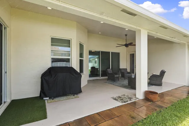 an aerial view of a house with a garden and a yard