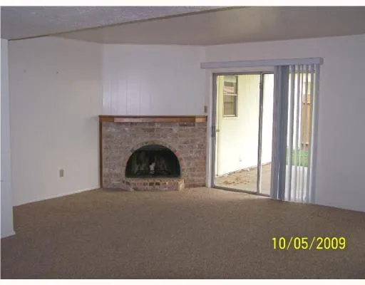 a view of a livingroom with a fireplace