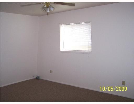5013 Meandering Lane, Unit B Corpus Christi, TX 78413 - Photo 7 of 10 an empty room with a window