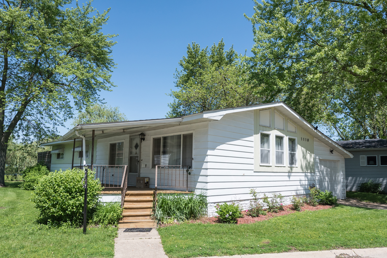 1110 Lakewood Road Elgin, IL 60123 - Photo 1 of 24 a front view of a house with a yard