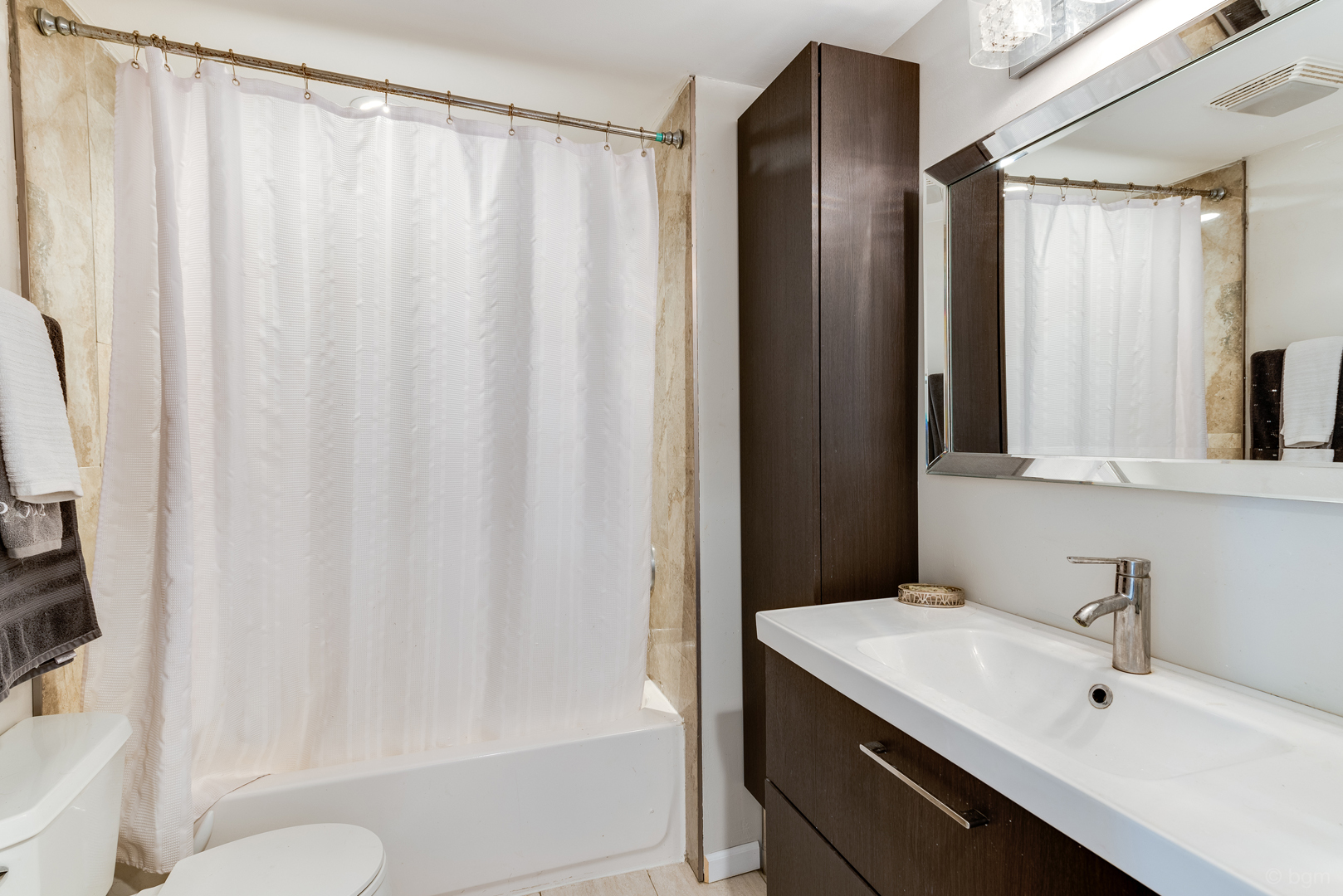 1110 Lakewood Road Elgin, IL 60123 - Photo 17 of 24 a bathroom with a sink and a mirror
